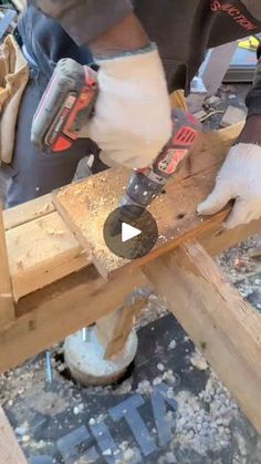 a man using a power tool on a piece of wood