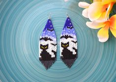 the beaded earrings are designed to look like darth vader's face