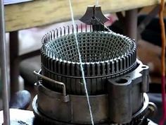 an old fashioned machine sitting on top of a table