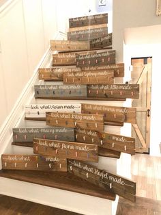 the stairs are decorated with wooden signs