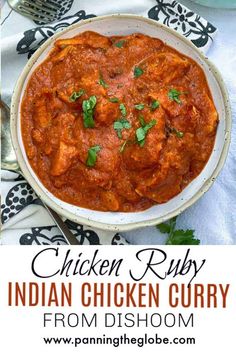 chicken curry in a white bowl on top of a table