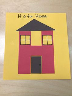 a paper cut out of a house with the words h is for house on it