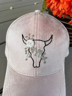 This hand embroidered hat will let everyone know you have the spirit of a cowgirl in your heart. The pattern is one of a kind with black, tan, cream, and gold blending together in a satisfying color palette. The ultra suede offers a little luxury and a touch of something different than your average baseball hat. This hat was so fun to bring together and it will make a fabulous addition to your outfit! Definitely blue heeler approved! Western Sewing Projects, Hand Embroidered Baseball Caps, Fitted Western Pink Hat, Embroidery Hats Baseball Caps, Pink Embroidered Hats With Curved Brim, Cute Pink Embroidered Hat, Cowboy Hat Embroidery, Pink Western Cap Hat, Embroidered Pink Baseball Cap