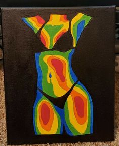 a painting on a black board with colorful shapes in the shape of a woman's torso