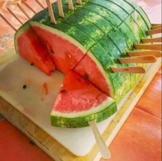 a large piece of watermelon is cut in half