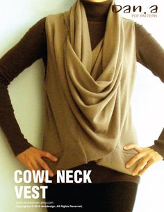 a woman is wearing a cowl neck vest with her hands on her hips while standing against a wall