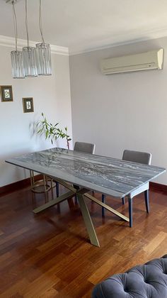 a dining room table with chairs and a bench