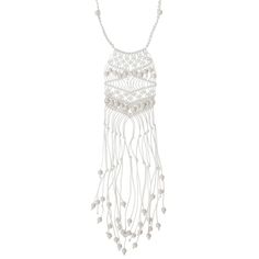 a white beaded necklace with beads and pearls hanging from the front, on a white background