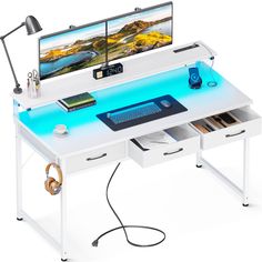 a computer desk with two monitors on it