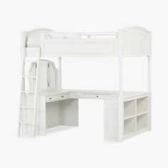 a white bunk bed sitting next to a desk and bookcase on top of it