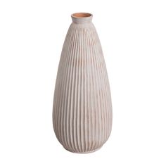 a white ceramic vase with wavy lines on the bottom and sides, sitting in front of a white background