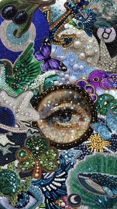 a close up view of an art work made with beads and other things on the surface