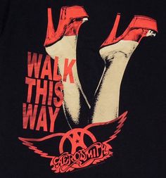 a black t - shirt with red and white graphics on the front, says walk this way