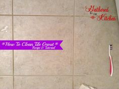 a toothbrush sitting on top of a tiled floor next to a purple ribbon that says how to clean the grout