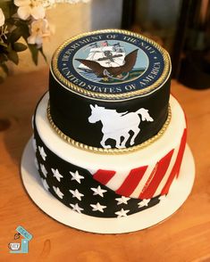 two tiered cake decorated with the seal of the united states