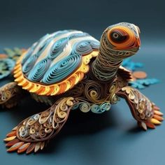 an intricately designed turtle made out of paper