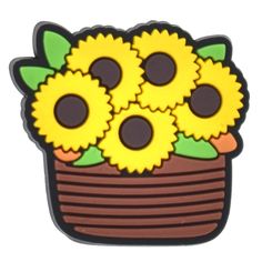 sunflowers in a basket with green leaves on the bottom and brown rimmed