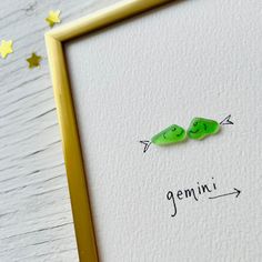 two peas are shown with the word genius written on them in cursive writing