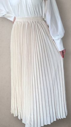 Modest high rise maxi skirt. Elastic waistband. Pleated. Fully lined for full coverage. Beige Fitted Maxi Skirt With Elastic Waistband, Fitted Beige Maxi Skirt With Elastic Waistband, White Full-length Skirt For Spring, White Full Length Skirt For Spring, Chic Stretch Maxi Skirt, White Full-length Maxi Skirt For Spring, Chic Long Pleated Skirt With Elastic Waistband, Beige Maxi Length Spring Bottoms, Beige Maxi Length Bottoms For Spring