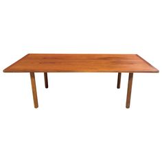 a wooden table with two legs and a long rectangular top on an isolated white background