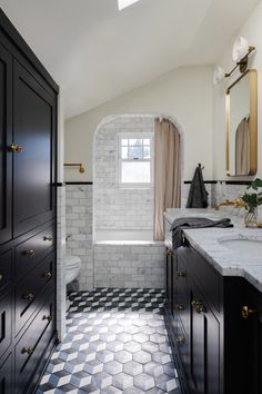 a bathroom with black and white checkered flooring