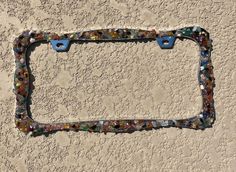 a license plate frame made out of glass beads