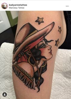 a woman with a cowboy hat on her thigh