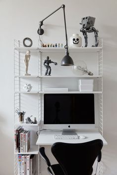 a white desk with a computer on top of it