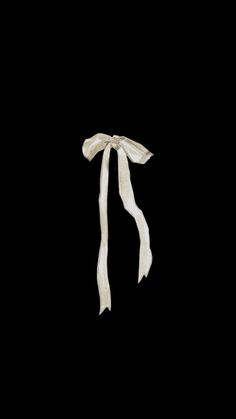 a white scarf tied to a black background