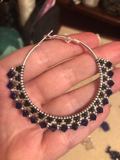 Glittering and elegant, these large hoops are sure to turn heads! Featuring lots of swar0vski crystal, glass beads, and 50mm sterling silver plated steel hoops with locking backs. Crystals are a deep cobalt blue that brightens with the surrounding light. Elegant Nickel-free Hoop Beaded Earrings, Elegant Nickel-free Beaded Hoop Earrings, Elegant Nickel Free Hoop Beaded Earrings, Elegant Beaded Sterling Silver Hoop Earrings, Silver Metal Beaded Hoop Earrings, Silver Beaded Hoop Jewelry, Silver Hoop Beaded Jewelry, Silver Beaded Hoop Earrings In Sterling Silver, Silver Sterling Beaded Hoop Earrings