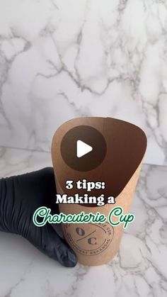 a person in black gloves holding up a cup with the words 3 tips making a cranberry cup