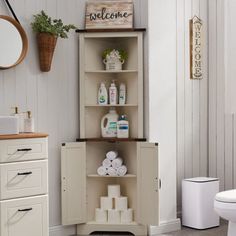 a bathroom with white walls and wooden shelves