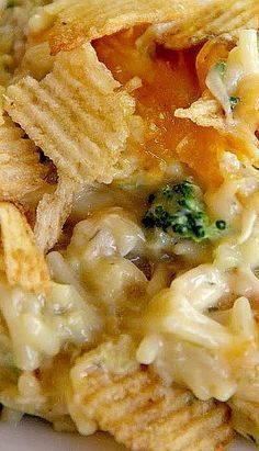 a close up of a plate of food with tortilla chips and broccoli