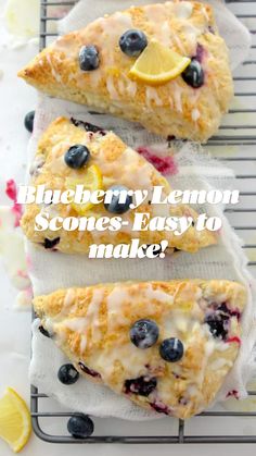 three lemon blueberry scones sitting on top of a cooling rack next to each other