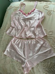 This is a gorgeous pink silky set of short pajamas! Perfect for sprimg! Perfect  if you love pretty girly things! Very soft feminine girlycore! I just adore the little rosettes on the top! Beautiful condition! Very coquette style! Size XL  100% polyester   I can't wait for someone to have this beauty! Feminine Pajamas, Coquette Pajamas, Spiderverse Dr, Victoria + Core, Romantic Coquette, Aesthetic Feminine, Pajamas Aesthetic, Pajamas Short, Feminine Casual