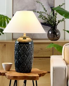 Complete the arrangement of your living room or bedroom with this functional, but also an extremely decorative lamp. Its ceramic base is very stable, and the pattern visible on its surface adds a unique character to the piece. The contrasting cone-shaped lampshade is made of linen, which guarantees a subtle and pleasant light that will certainly make reading in the evening more pleasant.  Details: Color: Blue, White. Main material: Ceramic. Additional material: Linen.  Material Composition: 100% Linen Weight: 2.8 Assembly: Partial Assembly Required Lampe Decoration, Decorative Lamp, Ceramic Base, Bedside Table Lamps, Linen Material, Ceramic Table Lamps, Ceramic Table, Blue Ceramics, Lamp Decor