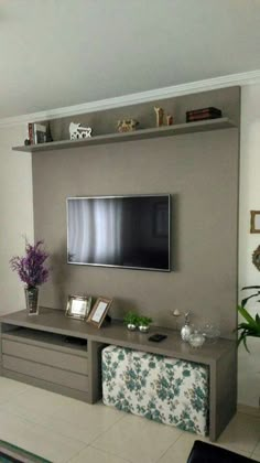 a flat screen tv mounted to the side of a wall