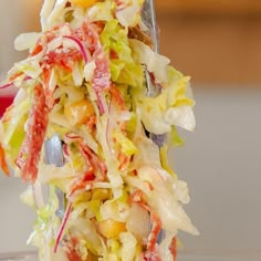 a close up of a salad on a fork