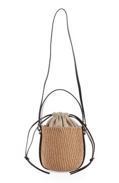 Elevate your warm-weather look with this compact basket bag designed with a drawstring lining and a leather version of the logo-embellished Woody strap. Drawstring closure Top carry handle; crossbody strap Lined Paper straw with leather trim Made in Italy Designer Handbags This brand has B Corp certification, representing business practices with emphasis on social and environmental performance, accountability and transparency This brand meets Nordstrom Responsible Brands criteria: brand adheres Luxury Leather Basket Bucket Bag, Chic Leather Bucket Straw Bag, Luxury Natural Bucket Bag With Detachable Strap, Luxury Shoulder Bag With Braided Handles For Spring, Luxury Basket Bag For Everyday, Luxury Natural Bucket Bag For Spring, Luxury Beige Basket Bucket Bag, Luxury Natural Color Bucket Bag For Spring, Luxury Basket-shaped Everyday Bag