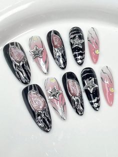 a bunch of fake nails that are sitting on a sink