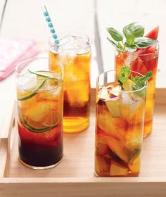 three glasses filled with different types of drinks