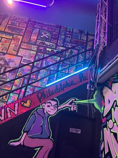 colorful graffiti on the walls and ceiling of a bar in philadelphia, pa with neon lights