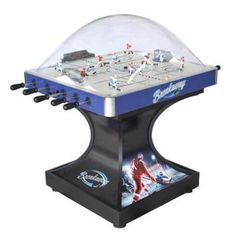 a foosball table with an ice hockey rink in the middle