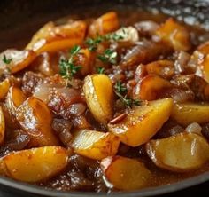 a bowl filled with stew and potatoes on top of a table