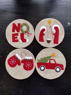 four felt coasters with christmas decorations on them