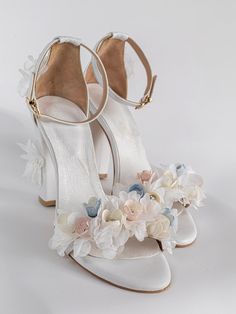 This is a pair of handmade comfortable and elegant block heels made from real leather for the upper body,straps and the inner sole. They are hand sewn and embellished with organza flowers ,real  silk cocoon flowers and real swarovski You can choose from different height for the heels such as 5,8 or 10 cm.Or different color .All shoes are custom made with your measurements on your feet for perfect fit.available sizes from 35EU-41EU A matching clutch is also available.  shipping A class registered Wedding Block Heels, Bridesmaids Heels, Flower Heels, Wedding Shoes Bride, Flower Sandals, Flower Shoes, Floral Sandals, Floral Heels, Bridal Sandals