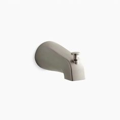 a white faucet mounted on the side of a wall with nozzles