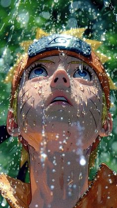 a young boy with blue eyes is looking up at the rain falling on his head