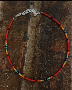 Czech beaded choker with color variations of red, turquoise, black, orange, and yellow. Adjustable choker style necklace. Western Style Beaded Necklace, Sead Bead Necklace, Black Beaded Necklace, Lubbock Tx