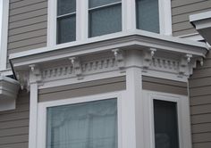 the corner of a house with two windows